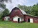 Red barn with peeling paint and a dilapidated, quaint look at 18229 Moontown Rd, Noblesville, IN 46062
