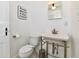 Stylish half bath features a modern vanity, square mirror, and toilet at 209 E John St, Alexandria, IN 46001