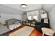 bedroom showcases a plush chair and twin window at 209 E John St, Alexandria, IN 46001