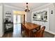 Inviting dining room with wood table, stylish lighting, and access to a built-in sideboard at 209 E John St, Alexandria, IN 46001