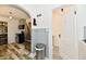 Bright kitchen with stainless steel appliances, patterned flooring, and access to a modern bathroom at 209 E John St, Alexandria, IN 46001