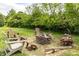 Relaxing backyard featuring a brick fire pit and comfortable Adirondack chairs at 2096 Whitetail Ct, Avon, IN 46123