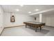 Finished basement with pool table and cue rack at 2096 Whitetail Ct, Avon, IN 46123