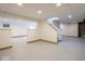 Unfinished basement area with stairs and drop ceiling at 2096 Whitetail Ct, Avon, IN 46123