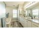 Bright bathroom featuring double vanity with granite countertops and modern fixtures at 2096 Whitetail Ct, Avon, IN 46123