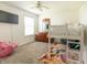 Cozy bedroom with a ceiling fan, carpet, and a bunk bed at 2096 Whitetail Ct, Avon, IN 46123