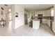 Open kitchen with white cabinets, a center island, stainless appliances and tile flooring at 2096 Whitetail Ct, Avon, IN 46123