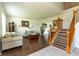 Inviting living room with hardwood floors, staircase, and comfortable seating at 2096 Whitetail Ct, Avon, IN 46123