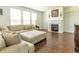 Bright living room with hardwood floors, fireplace, and large windows at 2096 Whitetail Ct, Avon, IN 46123