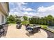 Spacious backyard patio with comfortable seating and a view of the lush lawn at 2096 Whitetail Ct, Avon, IN 46123