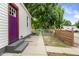 Exterior side view of house with purple door at 2164 E Raymond St, Indianapolis, IN 46203
