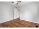 This bedroom features a ceiling fan and hardwood floors at 2164 E Raymond St, Indianapolis, IN 46203