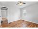 Bedroom with neutral walls, hardwood floors, and a window at 2164 E Raymond St, Indianapolis, IN 46203