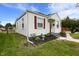 A cozy bungalow with lovely landscaping and unique window shutters at 2164 E Raymond St, Indianapolis, IN 46203