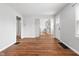 Open-concept living area with hardwood floors leading into the updated kitchen at 2164 E Raymond St, Indianapolis, IN 46203