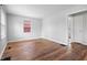 Bright living room featuring gleaming hardwood floors and fresh paint at 2164 E Raymond St, Indianapolis, IN 46203