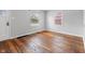 Living room featuring beautiful hardwood floors and sun-filled windows at 2164 E Raymond St, Indianapolis, IN 46203