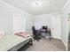 Bedroom featuring natural light, a desk setup for work or gaming, and a comfortable bed for relaxation at 2405 E 9Th St, Anderson, IN 46012