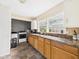 Functional kitchen featuring classic cabinetry, double windows, and modern appliances at 2405 E 9Th St, Anderson, IN 46012