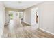 Open-concept space with hardwood flooring and seamless flow to the front door and kitchen at 2405 E 9Th St, Anderson, IN 46012