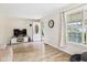 Inviting living room with a large window, hardwood floors, and modern decor at 2405 E 9Th St, Anderson, IN 46012