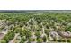 An aerial view of the community, showcasing the abundance of trees and nearby highway at 245 S Washington St, Danville, IN 46122