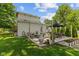 Large backyard with a patio, outdoor seating, and well-maintained lawn at 245 S Washington St, Danville, IN 46122