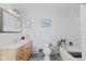 Well-lit bathroom with a vanity, toilet, bathtub, and tasteful decor at 245 S Washington St, Danville, IN 46122