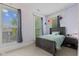 Serene bedroom with neutral carpet, large windows, and a comfortable bed with matching nightstand at 245 S Washington St, Danville, IN 46122