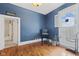 Bright bonus room showcasing hardwood floors and an open window with shutters at 245 S Washington St, Danville, IN 46122