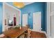 Charming dining area featuring classic wood accents and bright blue walls at 245 S Washington St, Danville, IN 46122