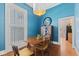 Inviting dining room with natural light, wood floors, and stylish decor at 245 S Washington St, Danville, IN 46122