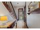 Welcoming foyer with a wooden staircase, console table, and a view of the front door at 245 S Washington St, Danville, IN 46122