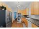 Well-equipped kitchen featuring stainless steel appliances, light wood cabinetry, and hardwood floors at 245 S Washington St, Danville, IN 46122