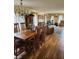 Open-concept dining room flowing into a spacious living area with great natural light at 247 Meridian Ct, Pittsboro, IN 46167