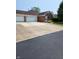 Charming brick home featuring an attached two-car garage and a paved driveway at 247 Meridian Ct, Pittsboro, IN 46167
