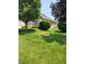 Well-manicured lawn surrounding a brick home, offering a serene outdoor setting at 247 Meridian Ct, Pittsboro, IN 46167