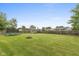 Large backyard with a fire pit, trampoline, shed and lush green grass at 2782 Branigin Creek Blvd, Franklin, IN 46131