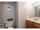 Powder room features a cream-colored toilet, vanity with a light countertop, and a neutral paint scheme at 2782 Branigin Creek Blvd, Franklin, IN 46131