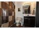 Bathroom features a wooden vanity, shower with patterned curtain, and neutral wall color at 2782 Branigin Creek Blvd, Franklin, IN 46131