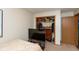 Bedroom featuring plush carpet, a large closet and door frame, and a television at 2782 Branigin Creek Blvd, Franklin, IN 46131