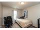 Bedroom with neutral walls, plush carpet, and a window with bright natural light at 2782 Branigin Creek Blvd, Franklin, IN 46131
