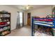 Bedroom featuring a bunk bed, window, plush carpet, and neutral wall color at 2782 Branigin Creek Blvd, Franklin, IN 46131