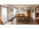 Bright dining area with wood table, chairs, and a window overlooking the backyard at 2782 Branigin Creek Blvd, Franklin, IN 46131