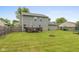 View of the house from the backyard, with a deck, a patio, and a spacious lawn at 2782 Branigin Creek Blvd, Franklin, IN 46131