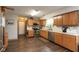 Functional kitchen with stainless steel appliances, wood cabinets, and durable flooring at 2782 Branigin Creek Blvd, Franklin, IN 46131