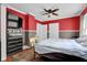 Comfortable bedroom featuring dark dresser, and bed with a view of the room with double door at 31 S Hinman St, Columbus, IN 47201