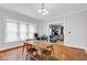 Inviting dining area with natural light, wood floors, and open access to the living room, perfect for entertaining guests at 31 S Hinman St, Columbus, IN 47201