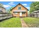 Charming single-Gathering home with a well-kept lawn, fenced yard, and inviting front entrance at 31 S Hinman St, Columbus, IN 47201