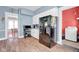 Functional kitchen featuring white cabinets, stainless steel appliances, and a seamless flow into the adjacent laundry room at 31 S Hinman St, Columbus, IN 47201